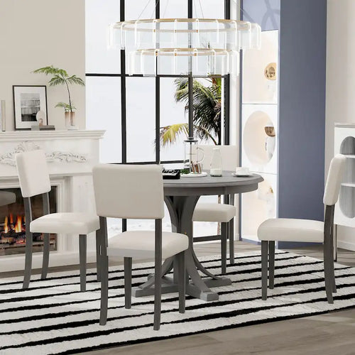 Ensemble de table et chaises de salle à manger rondes rétro 5 pièces, style ferme, avec pieds de table incurvés.