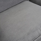 Canapé d'angle avec pouf amovible, en velours côtelé, en forme de L, à assise profonde, avec coussins lombaires et poches latérales.