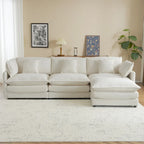 Canapé d'angle avec pouf amovible, en velours côtelé, en forme de L, à assise profonde, avec coussins lombaires et poches latérales.