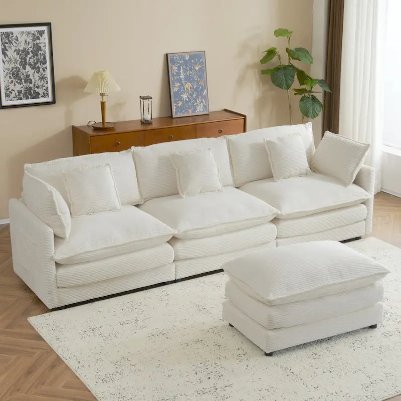Canapé d'angle avec pouf amovible, en velours côtelé, en forme de L, à assise profonde, avec coussins lombaires et poches latérales.