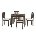Ensemble table et chaises pour coin repas dans la cuisine : table carrée en bois avec 4 chaises rembourrées.