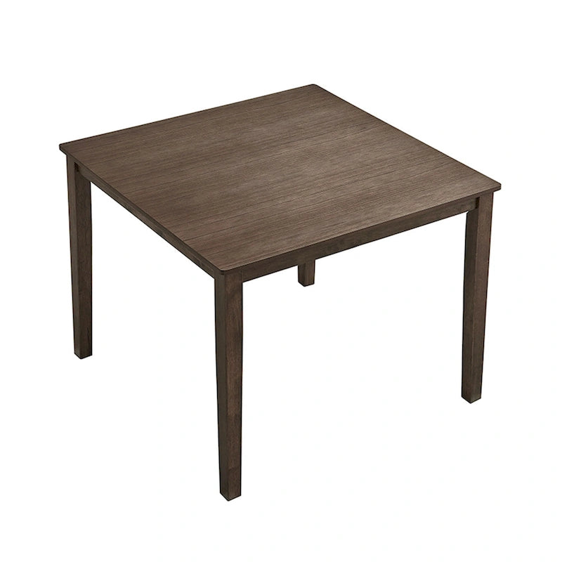 Ensemble table et chaises pour coin repas dans la cuisine : table carrée en bois avec 4 chaises rembourrées.