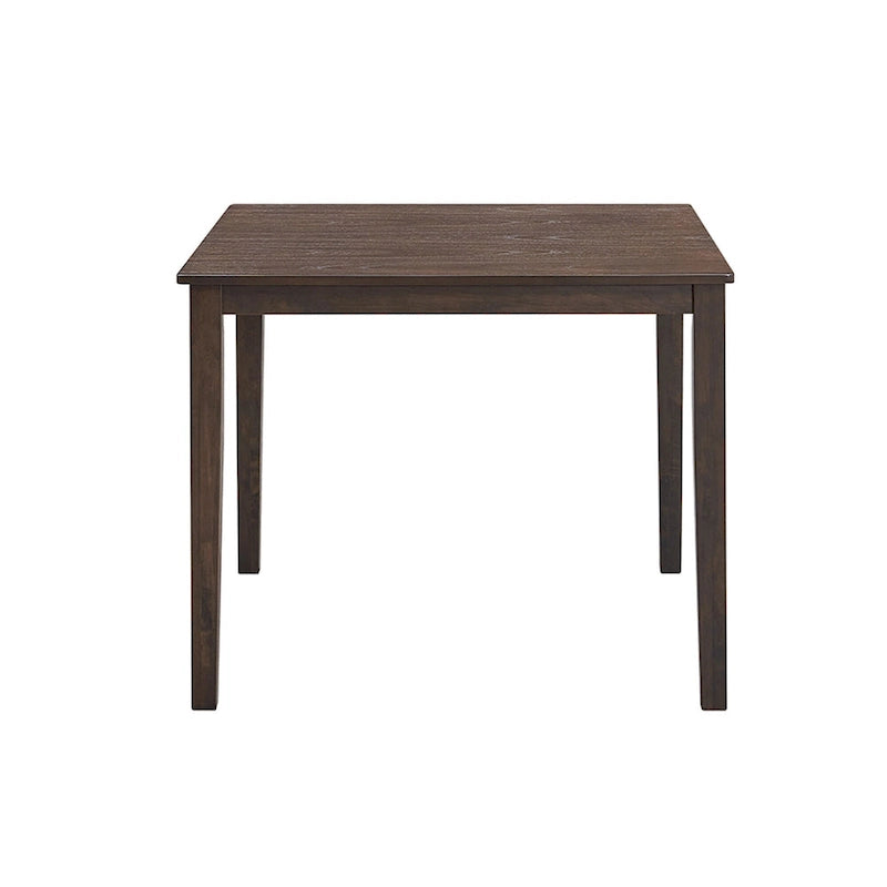 Ensemble table et chaises pour coin repas dans la cuisine : table carrée en bois avec 4 chaises rembourrées.