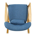 Fauteuil à bascule en bois massif avec coussin en lin et fabrication artisanale haut de gamme