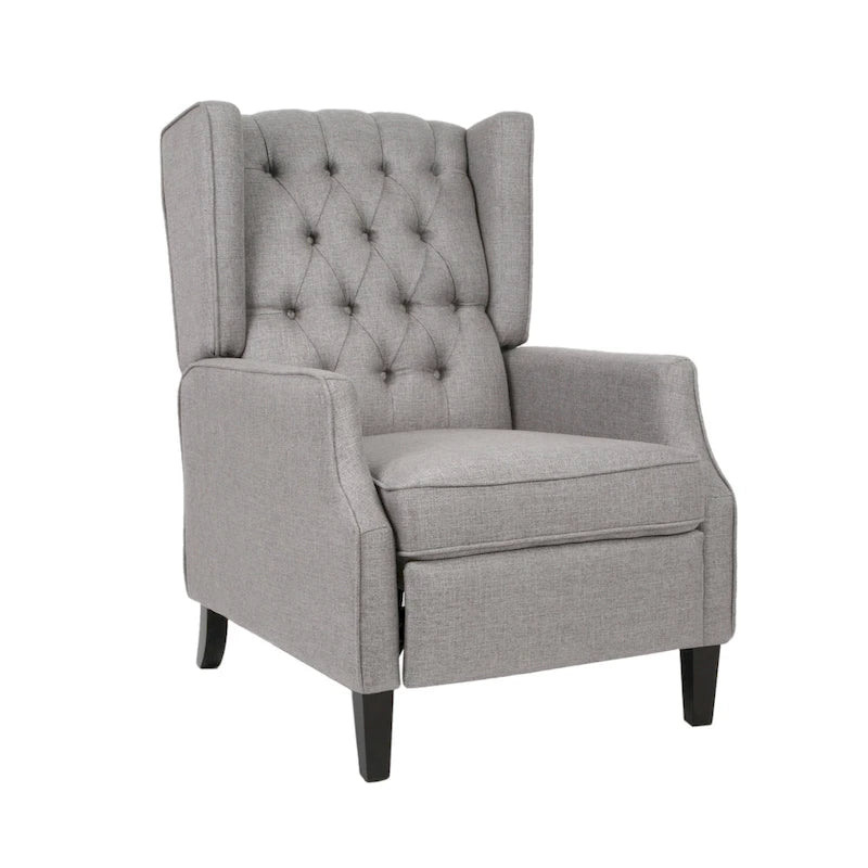 Fauteuil inclinable à oreilles de style mid-century, revêtu de tissu gris, avec repose-pieds et dossier capitonné.