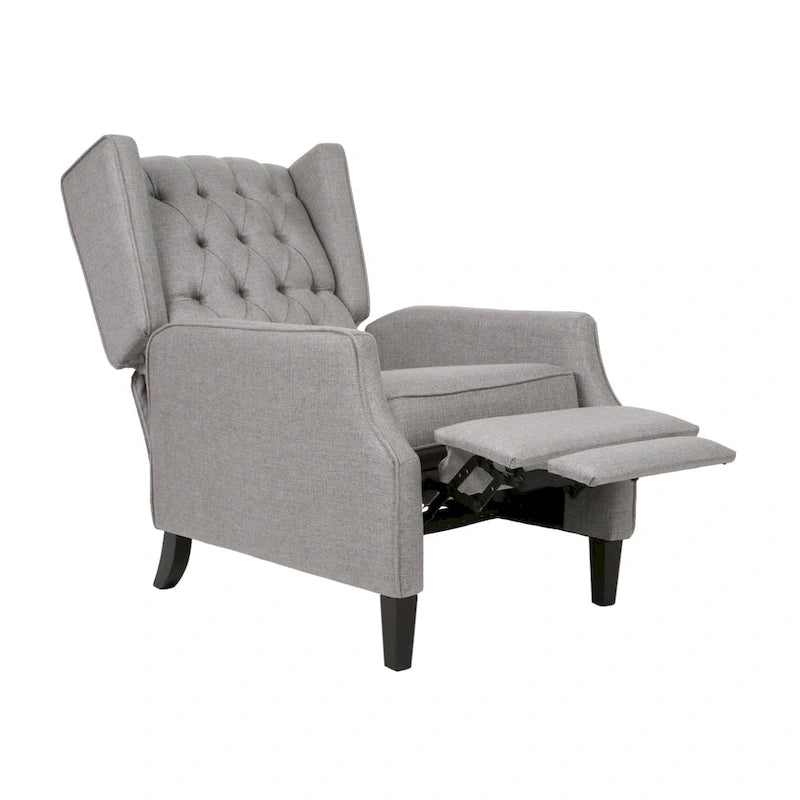 Fauteuil inclinable à oreilles de style mid-century, revêtu de tissu gris, avec repose-pieds et dossier capitonné.