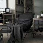 Fauteuil d'appoint Leonidas en similicuir noir avec structure en métal noir