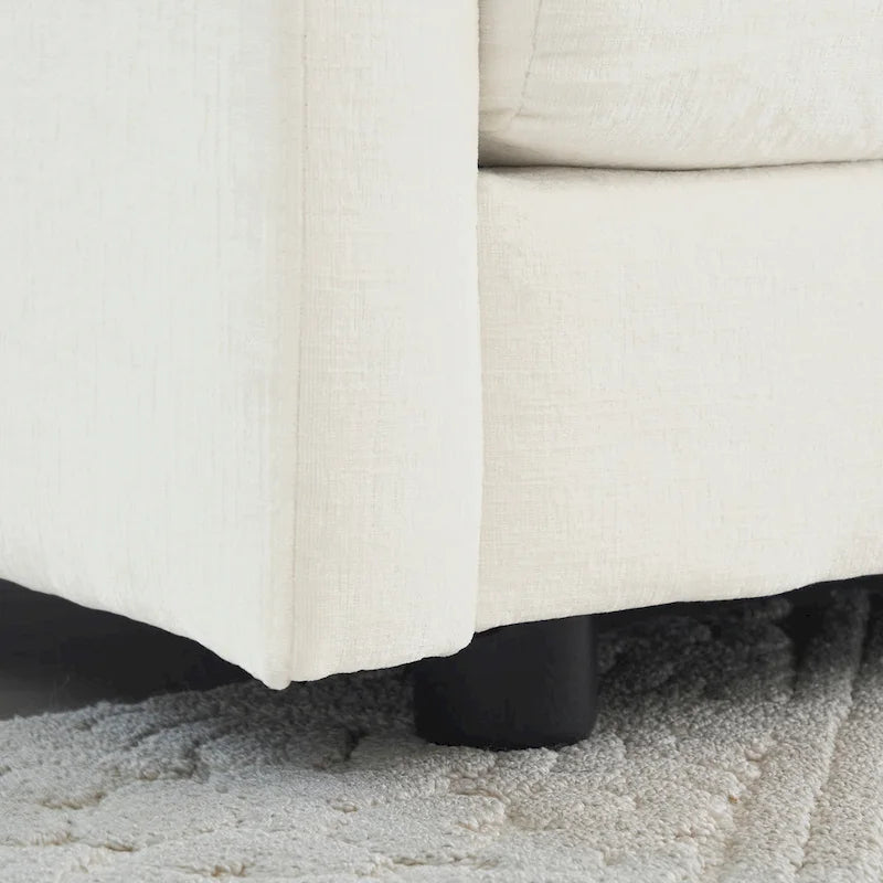 Fauteuil de lecture confortable et profond, une place, en tissu chenille blanc, avec 1 coussin décoratif.
