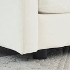 Fauteuil de lecture confortable et profond, une place, en tissu chenille blanc, avec 1 coussin décoratif.