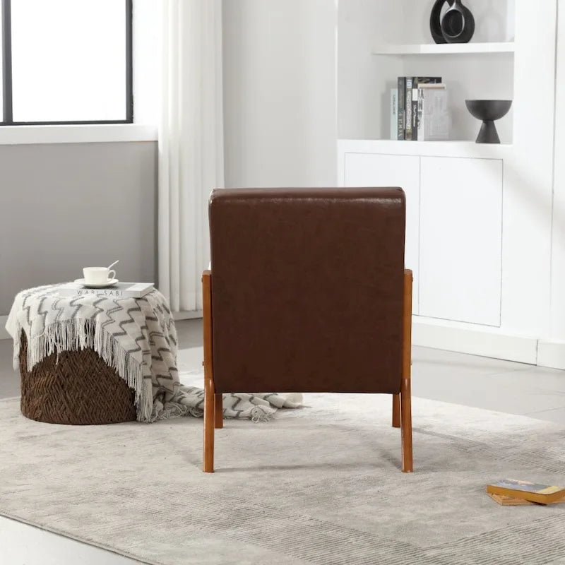 Fauteuil d'appoint moderne en similicuir avec un coussin